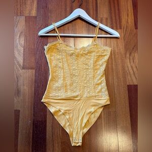 Light mustard orange bodysuit